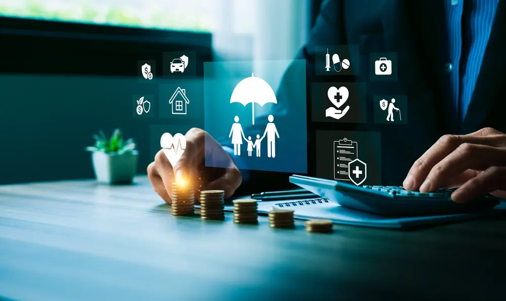 financialplanningandinsuranceprotectionconceptwithbusinessmanstackingcoins