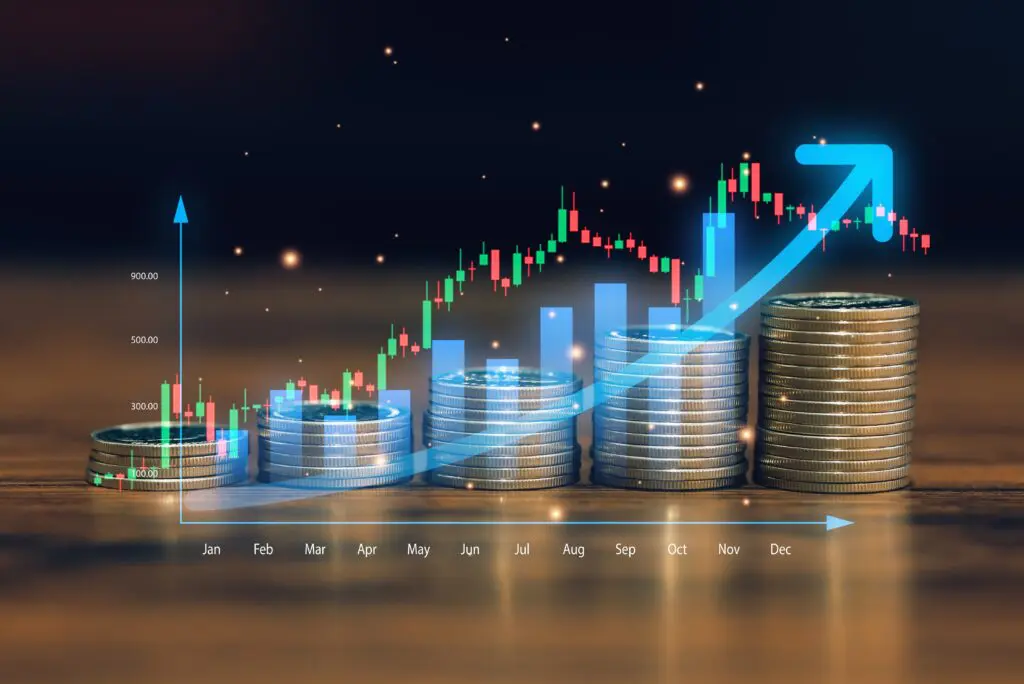 financialgrowthconceptwithstackedcoinsandrisingstockmarket